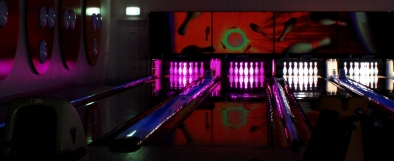 Photo - looking down toward lanes 1 and 2 the pins are lit with purple LED light